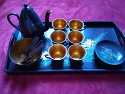 Lacquered coffee set kept in a display case, never used
