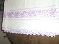 Beautiful antique white woven soft sheet with a purple vine pattern with a slinged edge
