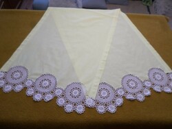 Pale yellow linen dresser tablecloth with snow-white crocheted lace at both ends, silk embroidery on the edge.
