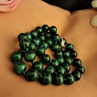 Malachite beads are the stone of perseverance