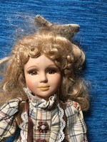 Beautiful blonde porcelain doll on a stand!