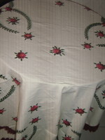 Elegant hand-embroidered tablecloth with a beautiful hand-crocheted edge