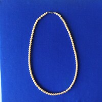 Vintage ecru string of pearls for sale!