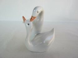 Couple of raven porcelain geese