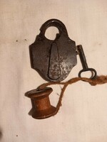 Very old wrought iron padlock with key