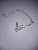 Silver colored (new) butterfly pendant necklace.
