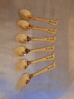 Old golden decorative spoon set with camel decoration