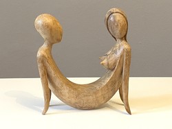 Togetherness carved loving couple woman and man nude carved wooden statue