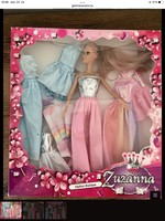 With Barbie-like doll clothes and accessories in a box