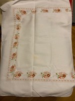 Folk, authentic, white linen tablecloth with beautiful floral border decoration