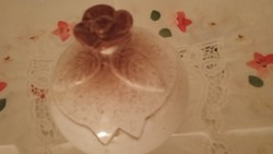 Small display container with a plastic rose-patterned lid