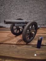 Large cannon, gun, old cast iron rammer on rubber wheels, the cannon is made of iron, with welding..