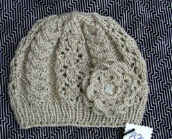Shiny beige women's hat with flowers, hand-knitted