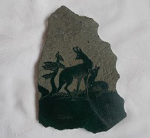 Carved stone wall decoration with a hunting scene