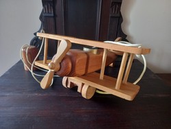 Retro wooden ceiling lamp in the shape of an airplane