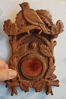Antique pocket watch holder wall carved from wood.