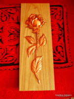Copper roses on a wooden background, wall hanging not used