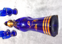 Blue glass with a polished stopper and 4 ingredients in a beautiful glass