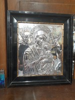 Old silver embossed religious icon image.