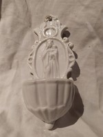 Old wall-mounted porcelain holy water container