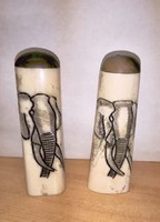 Bone carving salt and pepper shakers. Elephant with scratched decoration. Unique antique handicraft artefact is rare