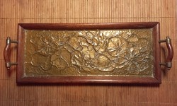 A small wooden tray with an inlaid copper plate.