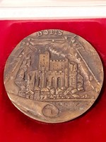 Dotis tata bronze plaque marked piece in its own box, 9.8 cm in diameter