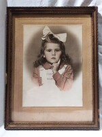 Antique child portrait in a large colored photograph frame