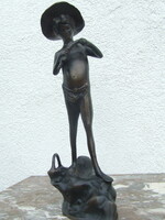 Boy peeling fish bronze