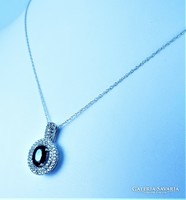 Dazzling 10k white gold necklace with blue and white sapphire gems!