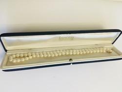 Cultured white string of pearls gold lock case vintage