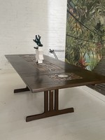 An expandable dining table for the holidays made by a unique marked oxart Danish industrial artist.