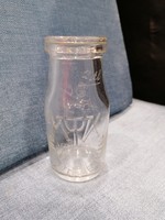 Region. M. T. K. Trademark milk bottle