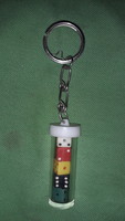 Retro traffic plastic cylinder with small plastic colored dice inside, key holder according to the pictures 1.