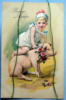 Antique embossed New Year greeting card - little girl with a pig