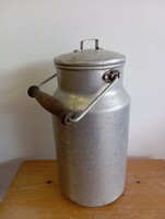 Retro or antique milk pail or jug.