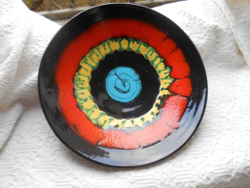 Large, brightly colored ceramic wall plate