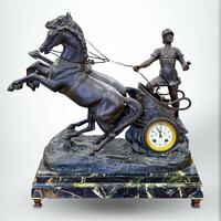 Figurative mantel clock with a French half-baker on a green marble plinth