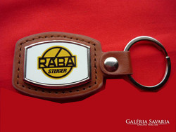 Rába steiger metal keychain on a leather background