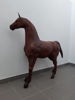 Large, antique leather horse statue