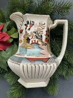 A wonderful old English earthenware hand-colored jug