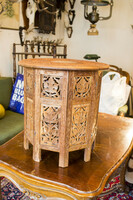 Richly carved side table / ottoman