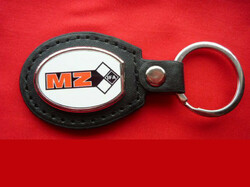 Mz (motorized) metal keychain on a leather background