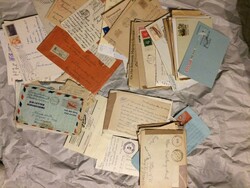 About 100 pieces of old envelopes and postcards in one