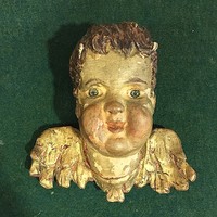 Antique, contemporary, carved baroque putto head