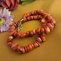 Coral string of pearls, the stone of abundance.