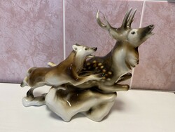 A wolf chasing a deer porcelain