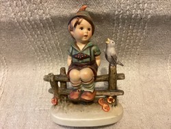 Hummel goebel porcelain figurine of a boy sitting on a fence marked with a bird