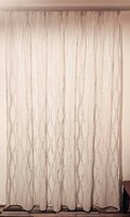 Gray-cream cropped curtain with a natural effect on an off-white background, ready-to-sewn, new