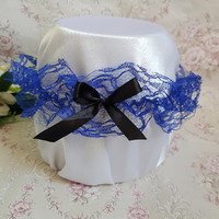 Purple lace bridal garter with black bow, thigh lace
